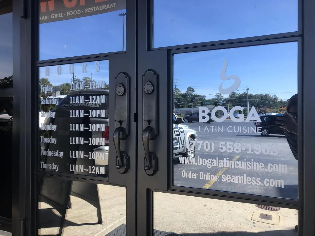 Boga door graphics with hours
