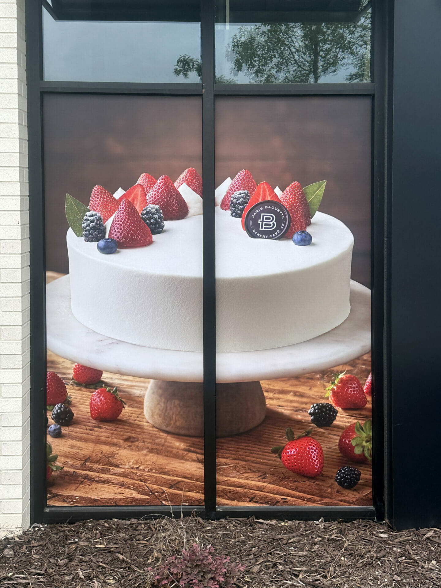 Perforated window film with product imagery