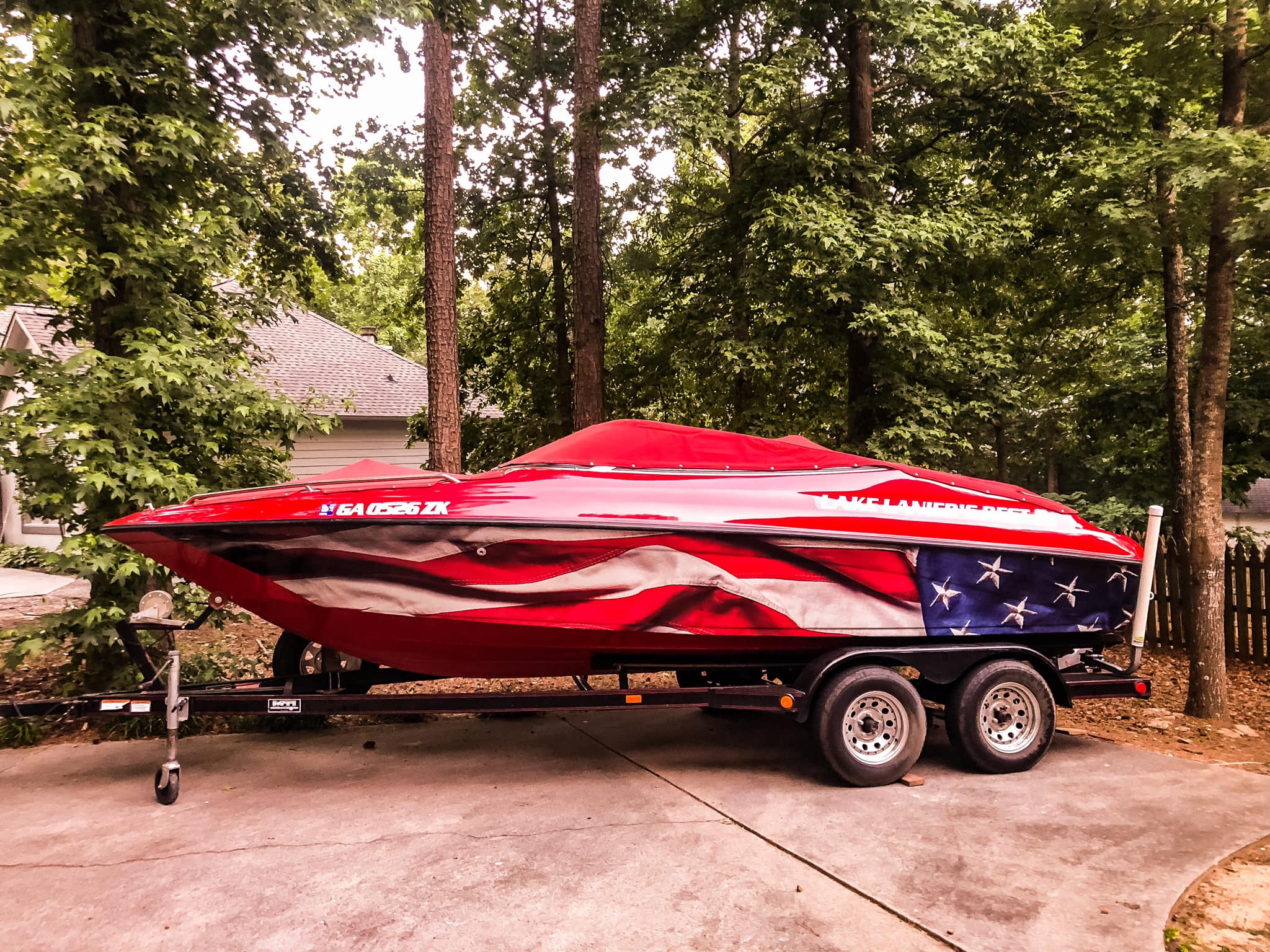 Red performance boat with American flag wrap design